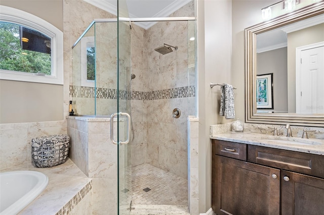 bathroom featuring ornamental molding, vanity, and shower with separate bathtub