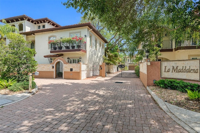 mediterranean / spanish home featuring a balcony