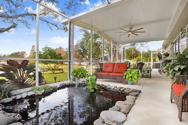 sunroom / solarium featuring ceiling fan