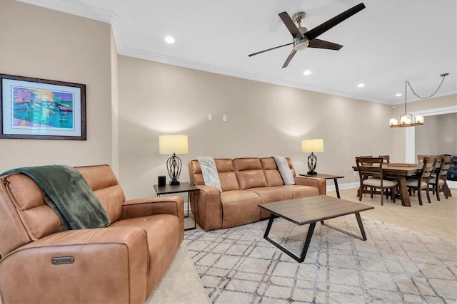 living room featuring ornamental molding, light colored carpet, and ceiling fan with notable chandelier