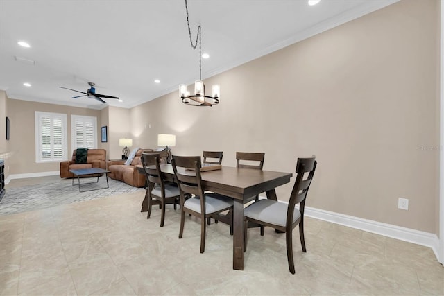 dining space featuring crown molding and ceiling fan with notable chandelier