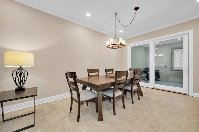 dining area with a notable chandelier and crown molding