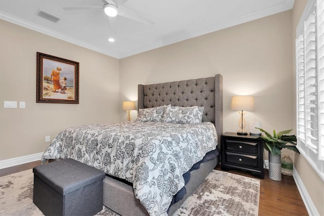 bedroom featuring ornamental molding, ceiling fan, and wood-type flooring