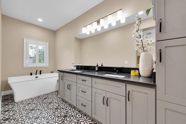 bathroom featuring vanity and a tub to relax in