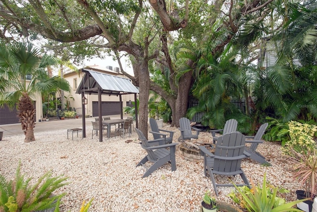 view of patio featuring a fire pit