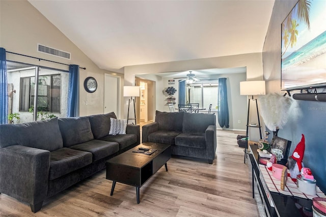 living room featuring high vaulted ceiling, ceiling fan, and light hardwood / wood-style floors