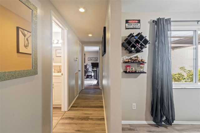 hall featuring wood-type flooring