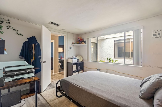 bedroom featuring light hardwood / wood-style flooring