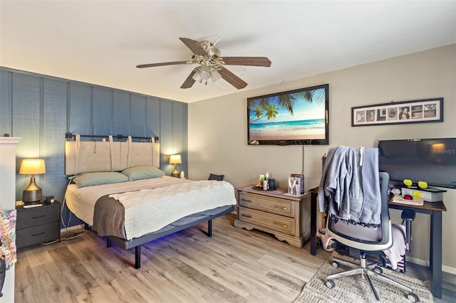 bedroom with ceiling fan and light hardwood / wood-style floors