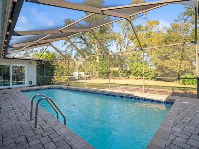 view of pool with a lanai and a patio