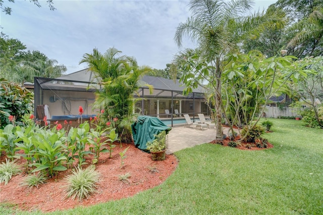 view of yard featuring a patio area, a swimming pool with hot tub, and glass enclosure