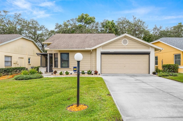 ranch-style home with a front yard and a garage