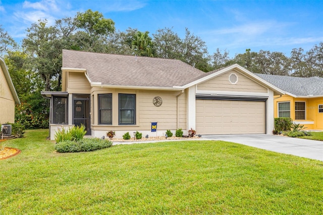 single story home featuring a sunroom, a front lawn, and a garage