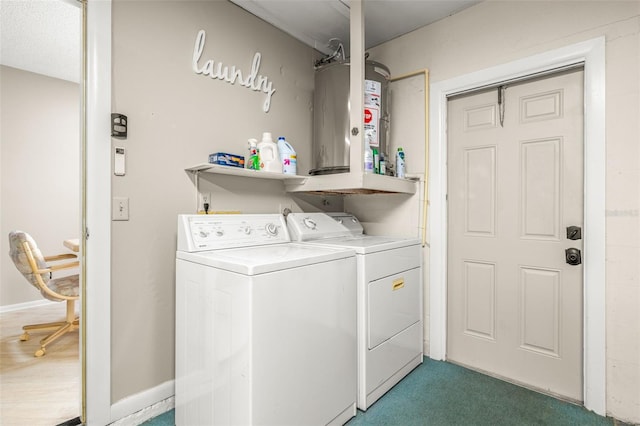 laundry room featuring dark carpet and washing machine and clothes dryer