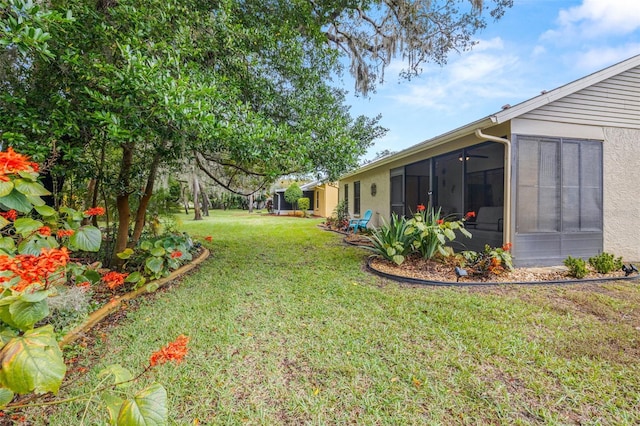 view of yard featuring a sunroom