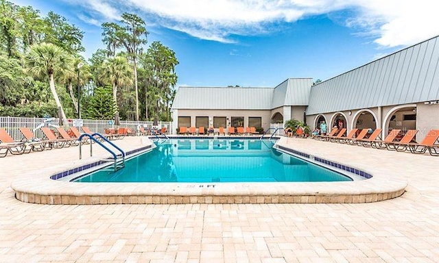 view of swimming pool featuring a patio