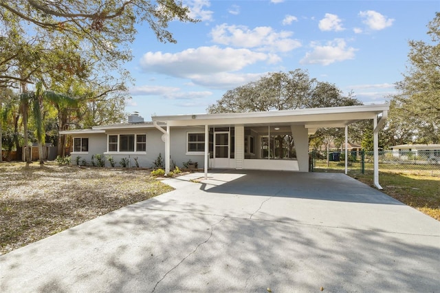 exterior space with a carport