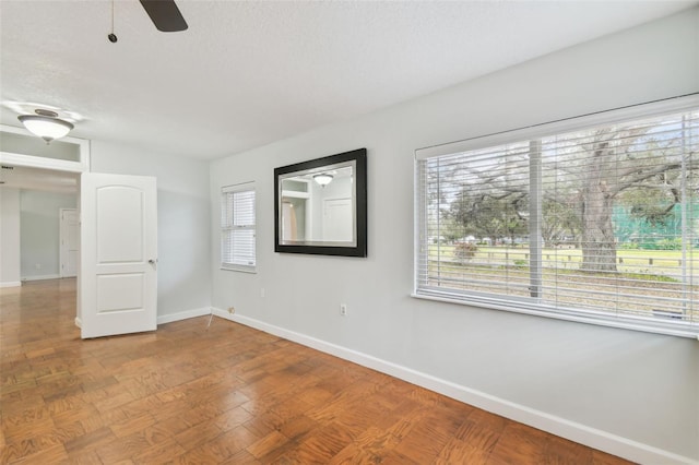 spare room with ceiling fan and hardwood / wood-style flooring