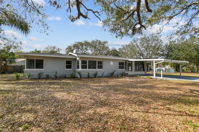 view of front of property with a carport