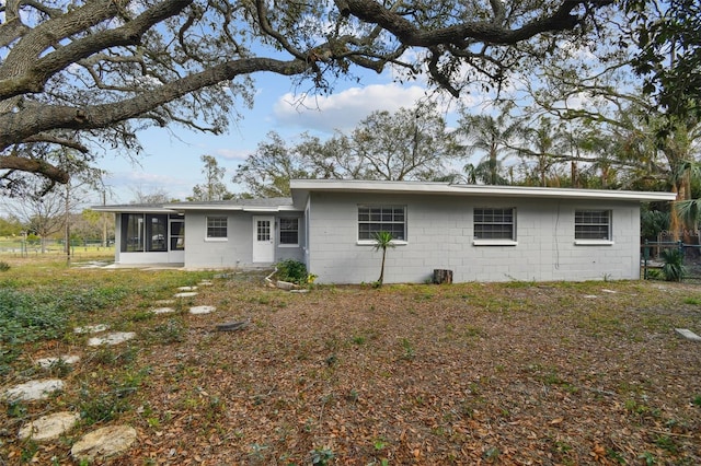 back of property featuring a sunroom