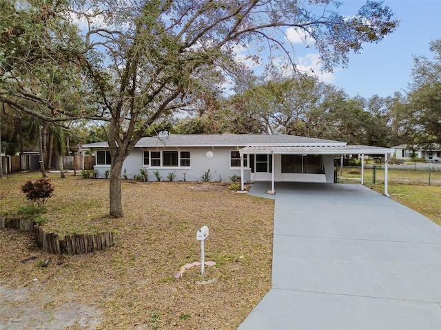 ranch-style house featuring a carport