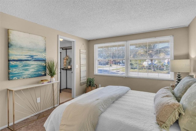 bedroom with carpet and a textured ceiling