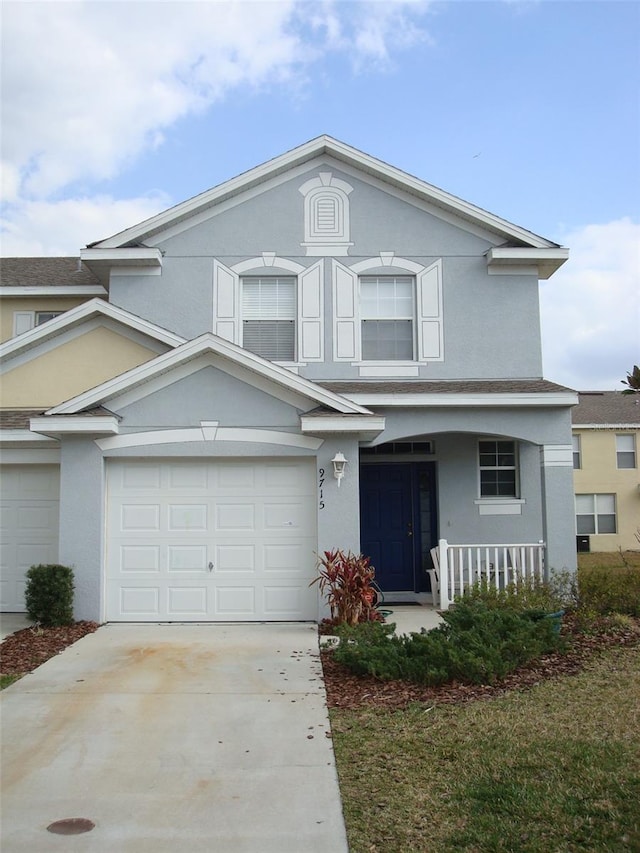 front facade with a garage and a porch