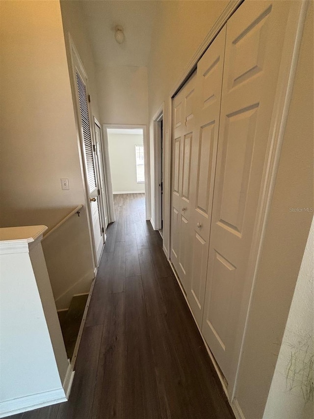 hall with dark wood-type flooring