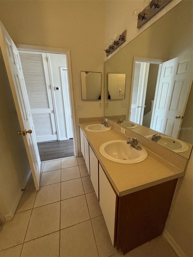 bathroom with tile patterned flooring and vanity