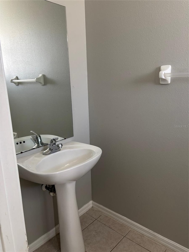 bathroom featuring sink and tile patterned flooring