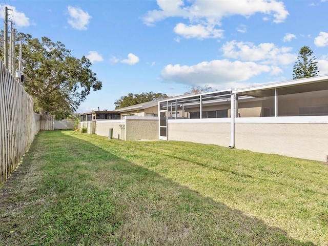 view of yard with a fenced backyard