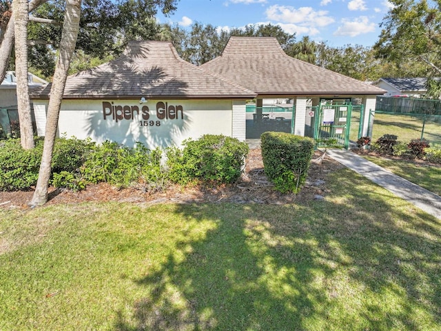 view of property exterior featuring a shingled roof
