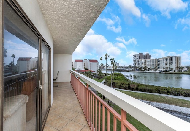 balcony featuring a water view