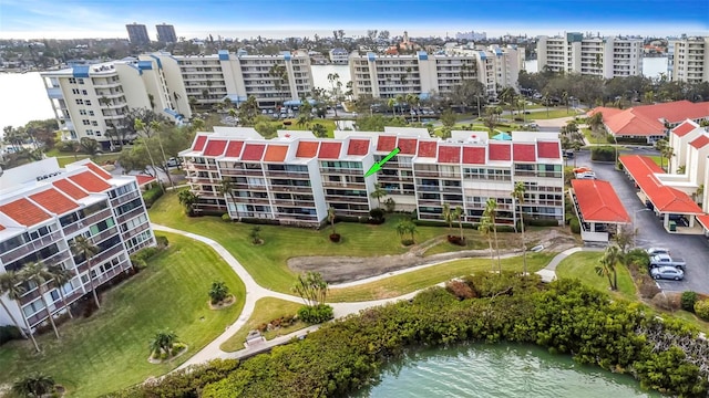 birds eye view of property with a water view