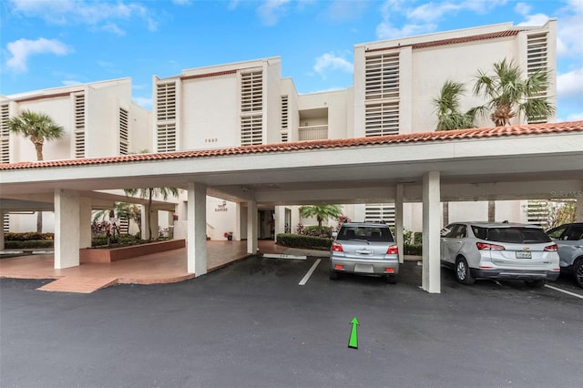 view of parking / parking lot with a carport