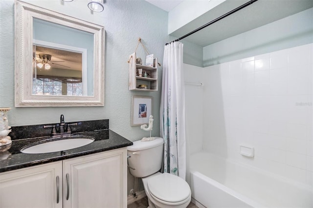 full bathroom featuring toilet, ceiling fan, shower / bath combination with curtain, and vanity