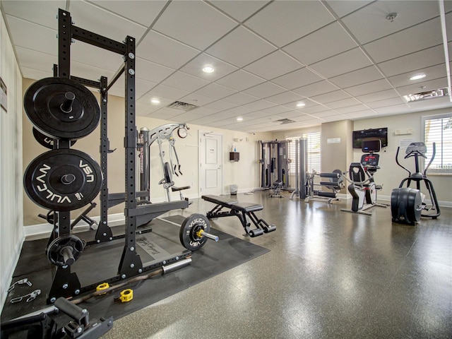 workout area featuring a paneled ceiling