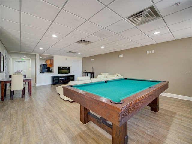 game room featuring pool table, light hardwood / wood-style floors, and a drop ceiling