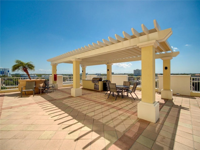 view of patio / terrace with an outdoor kitchen, grilling area, and a pergola