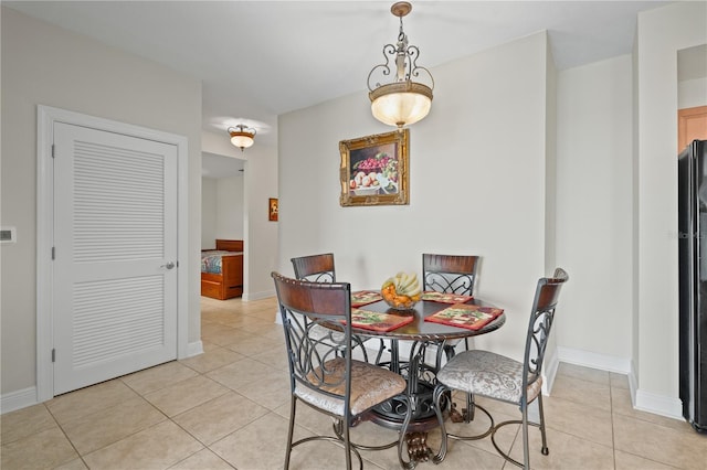 dining area with light tile patterned floors