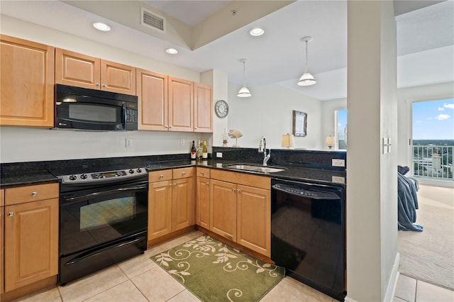 kitchen featuring sink, light tile patterned flooring, black appliances, and pendant lighting