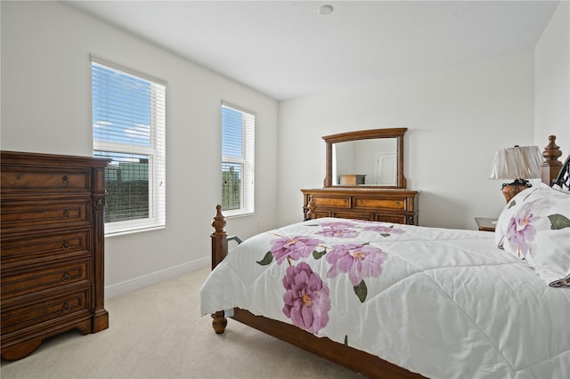 bedroom featuring light carpet