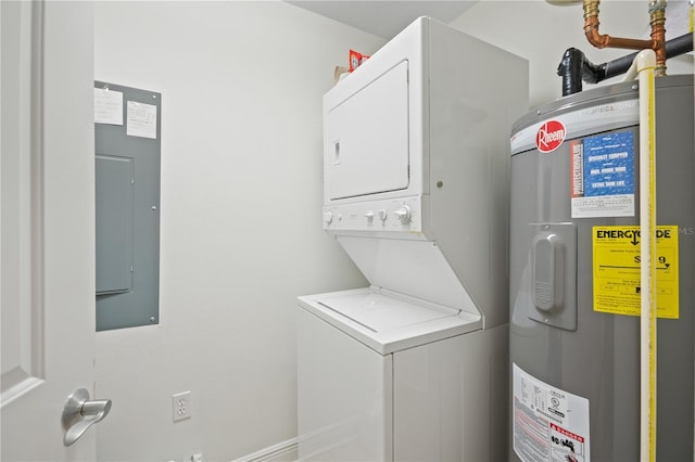 washroom featuring electric water heater, stacked washing maching and dryer, and electric panel