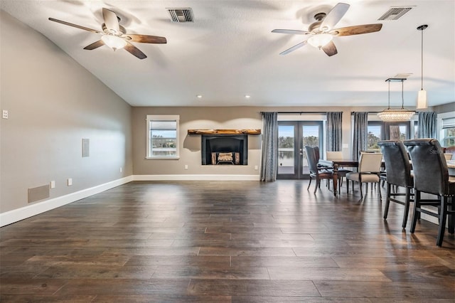 living room featuring lofted ceiling, ceiling fan, and dark hardwood / wood-style floors