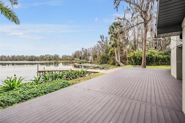 wooden terrace featuring a dock and a water view