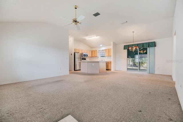 unfurnished living room featuring ceiling fan with notable chandelier, light colored carpet, and lofted ceiling