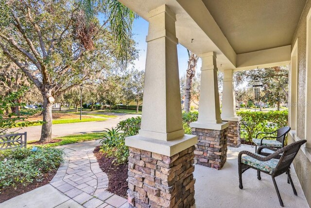 view of patio featuring a porch