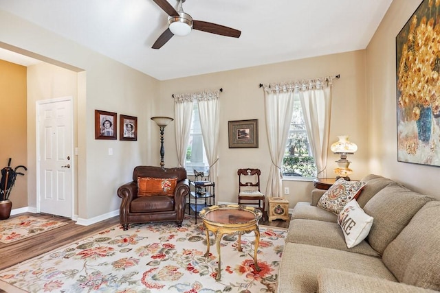 living room featuring ceiling fan and wood-type flooring