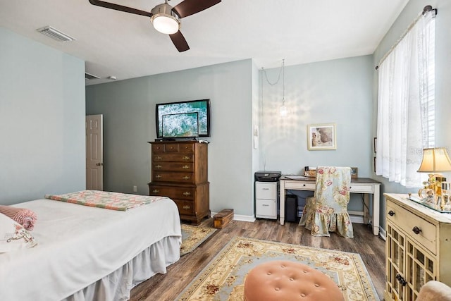 bedroom featuring ceiling fan and dark hardwood / wood-style flooring