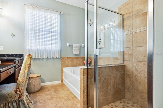 bathroom featuring tile patterned flooring and separate shower and tub